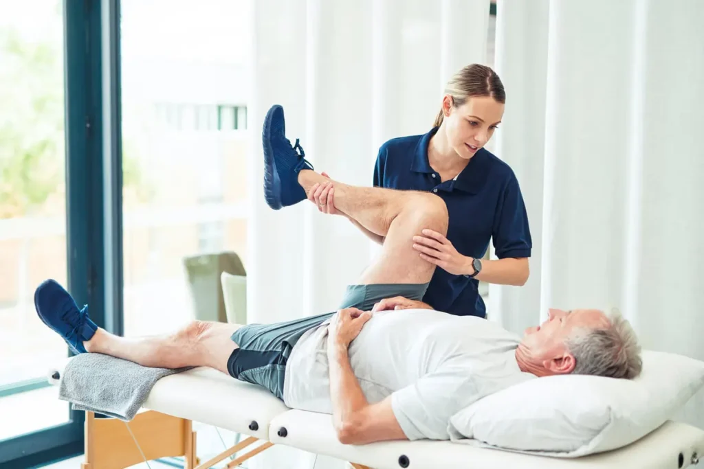 Revitalising Recovery: Effective Rehabilitation Strategies for Muscle Injuries 3 Physiotherapist assisting a patient with muscle recovery exercises Cheshire
