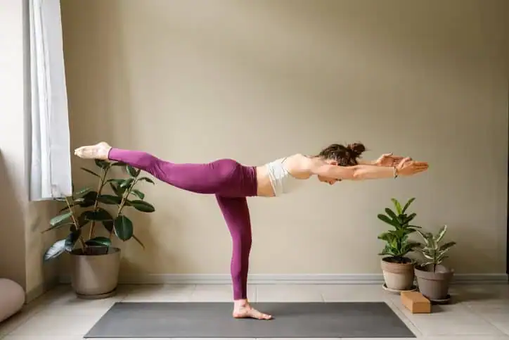 Woman doing Yoga exercise Cheshire to help with toning the body. 