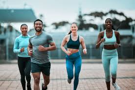 Sculpting Sleek Arms: The Essential Role of Cardio in Toning Without Bulking Up 3 image of people running to incorporate cardio Cheshire exercise into their life to help tone arms and body.